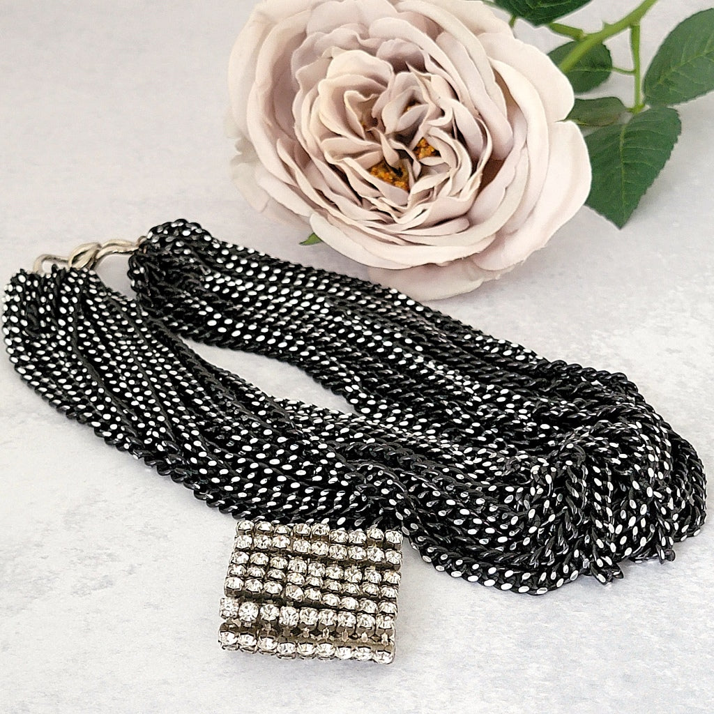 Chain choker necklace with removeable rhinestone enhancer.
