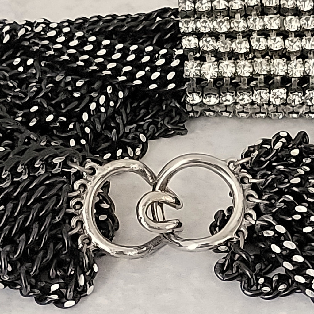Hook clasp on a multistrand chain necklace.