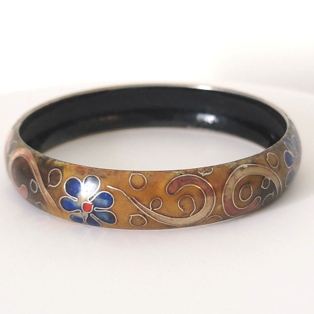 Cloisonne enamel bracelet with blue flowers.