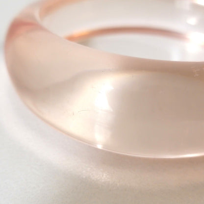 Close up of clear plastic bracelet.