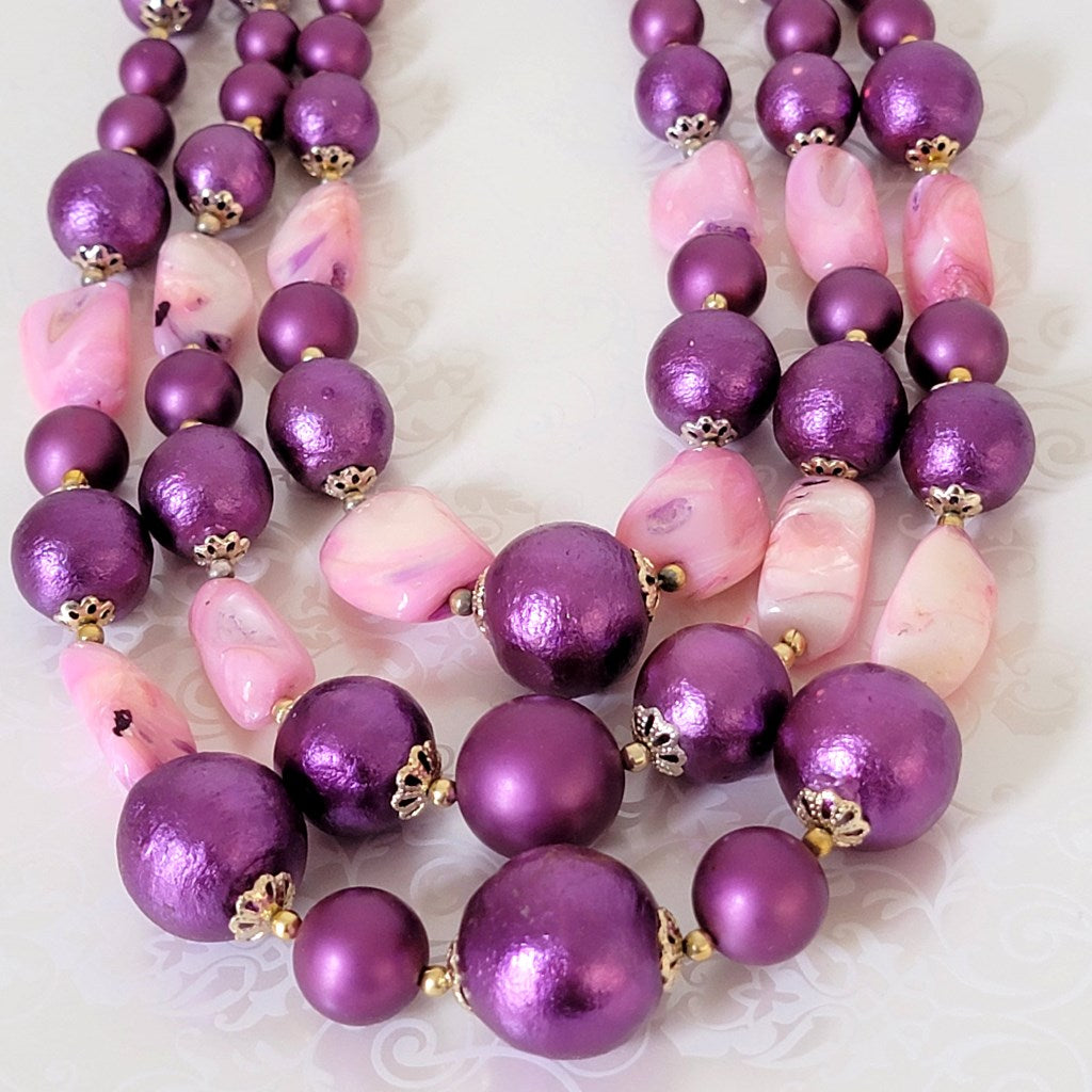 Purple cotton pearl and pink shell beads.