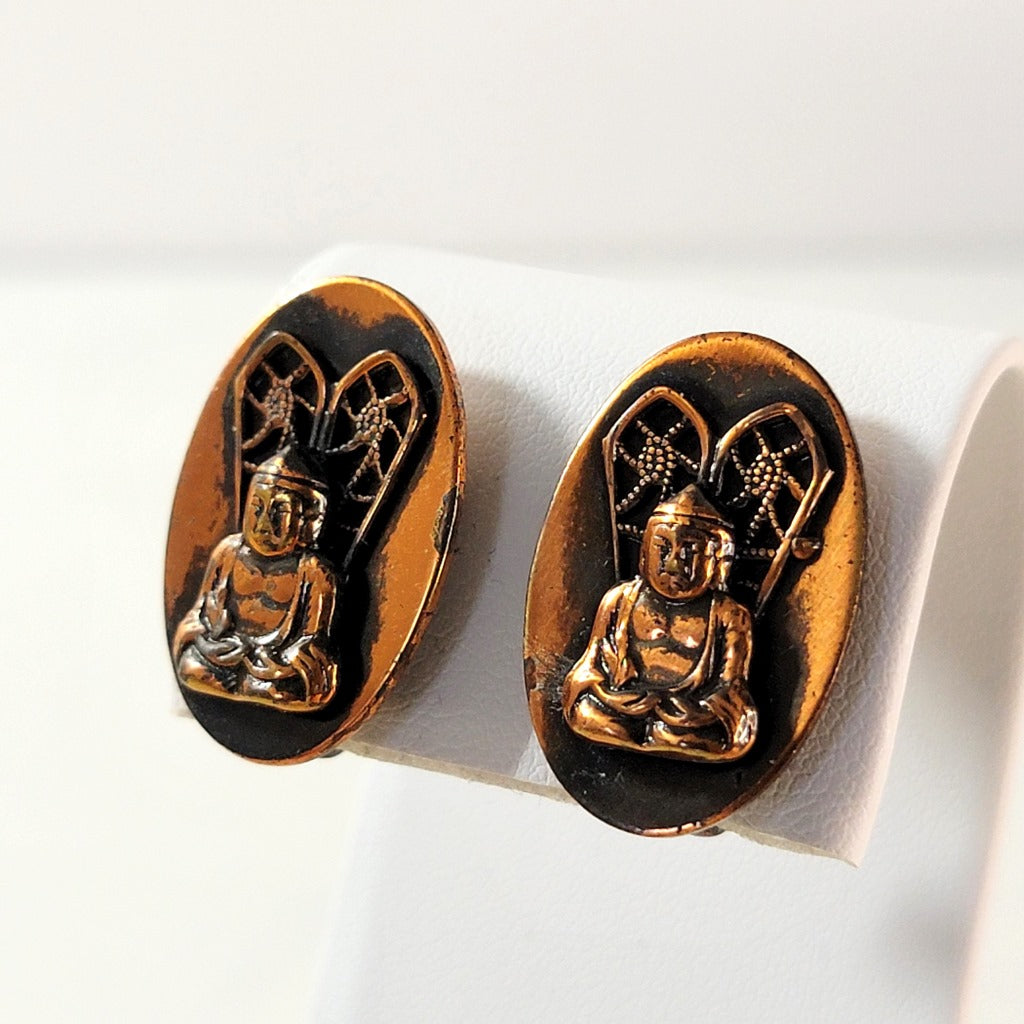 Copper Buddha earrings.