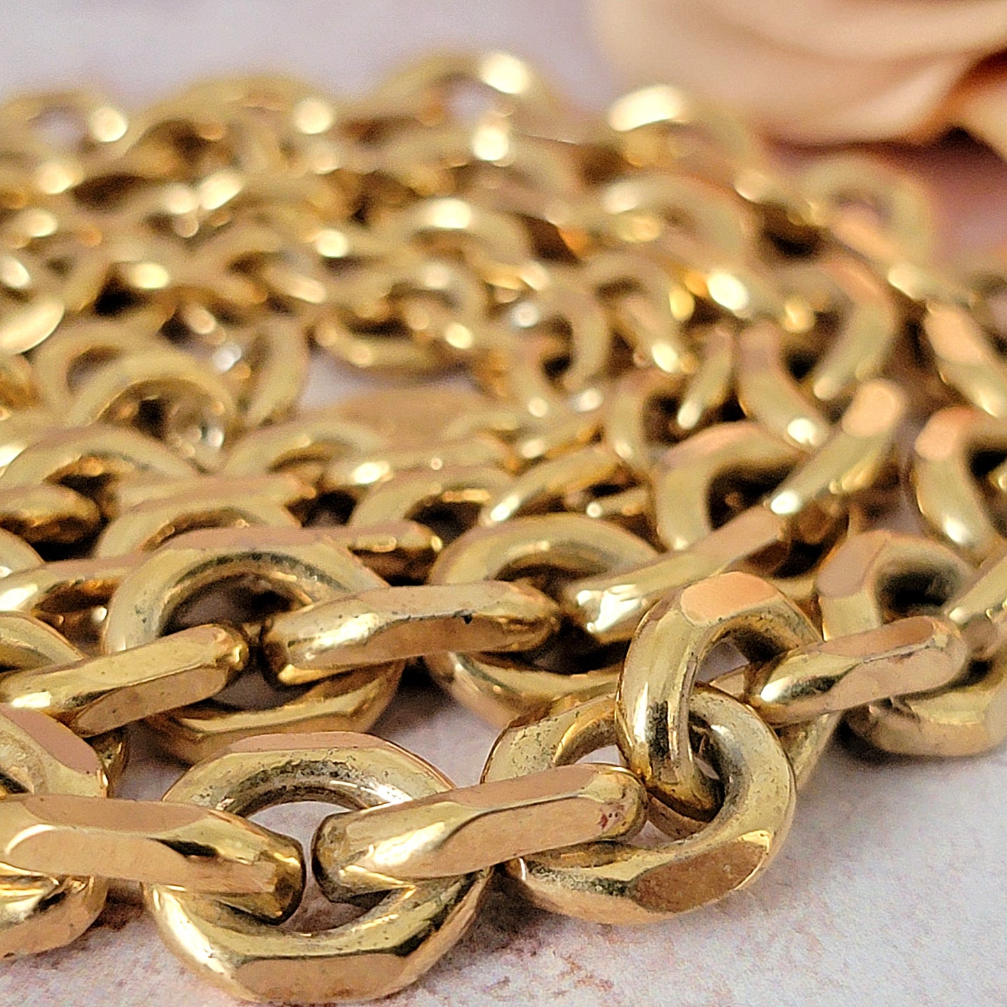 Gold plated necklace chain links.