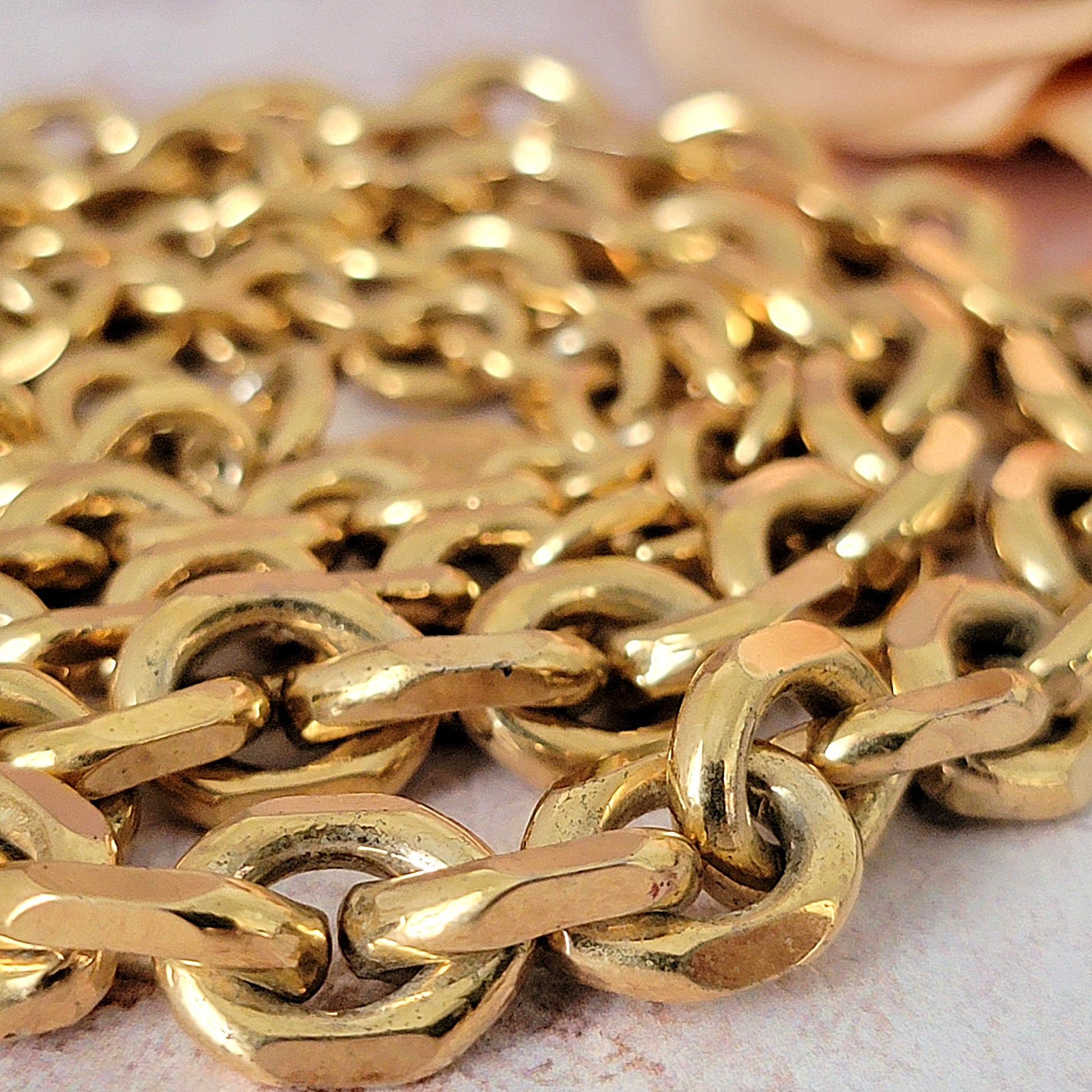 Gold plated necklace chain links.