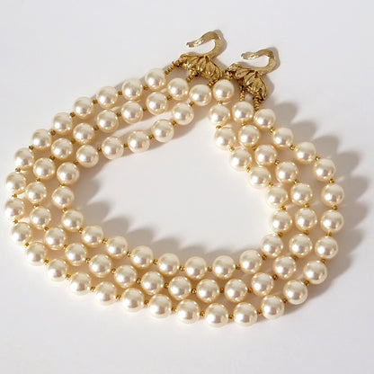 Three strand faux pearl choker.