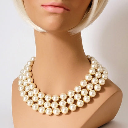 Faux pearl choker on mannequin.