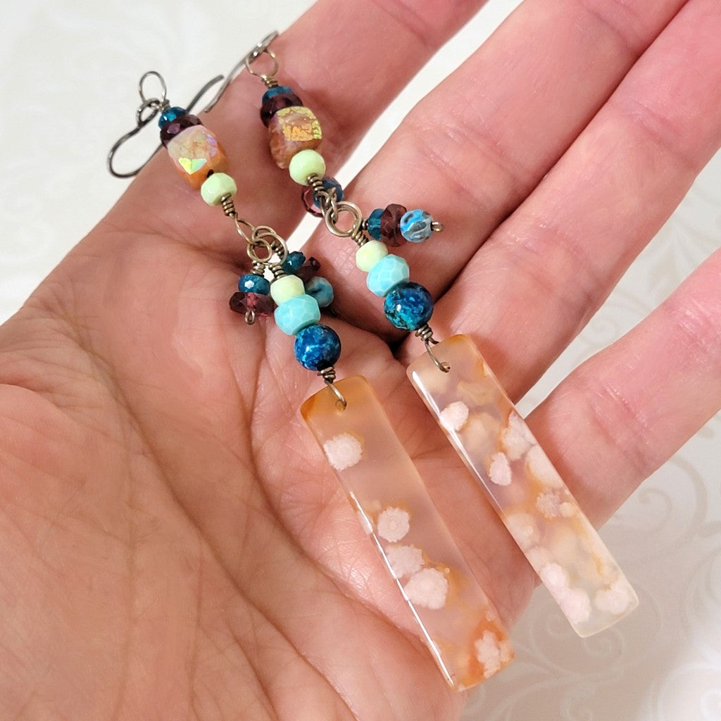 Flower agate colorful gemstone earrings, shown in hand, for size comparison.
