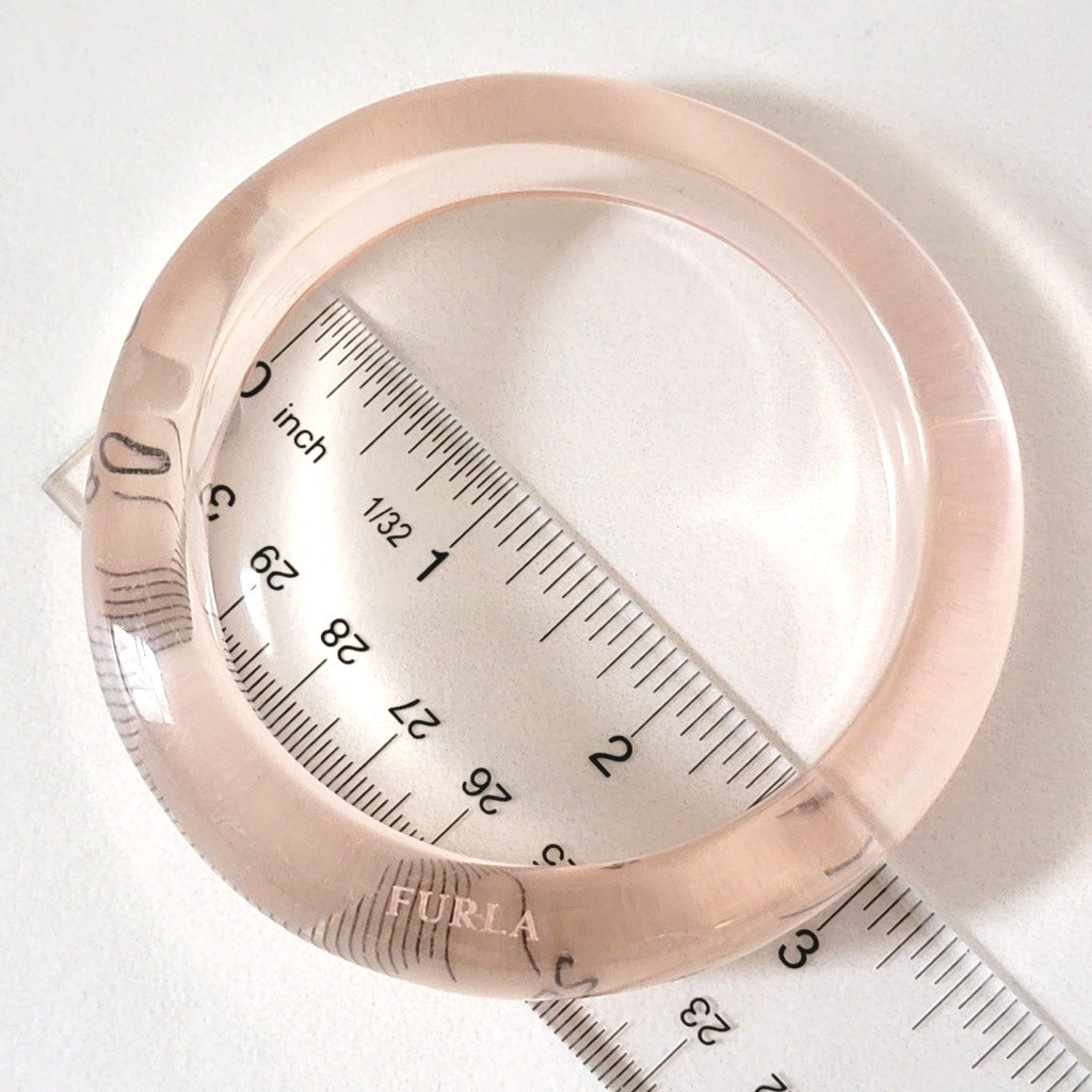 Clear plastic bracelet with ruler.