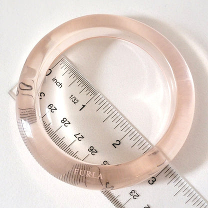 Clear plastic bracelet with ruler.
