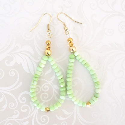 Handmade green opal beaded dangle earrings, with gold crystal accents.