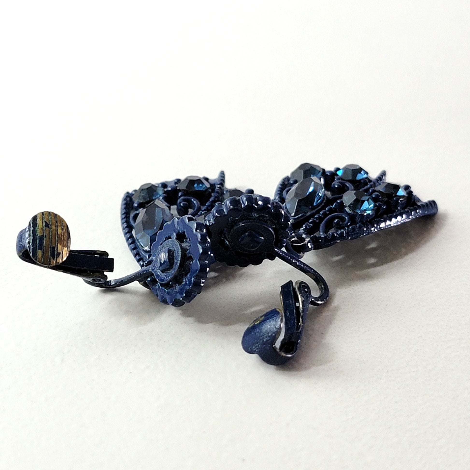 Inside of clip-on earrings.