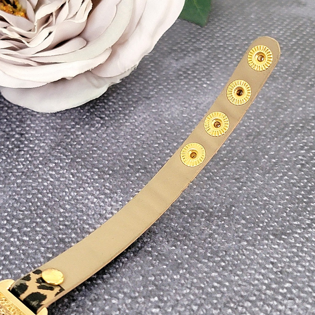 Inside strap on a bracelet.