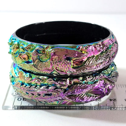 Plastic bangles on ruler.