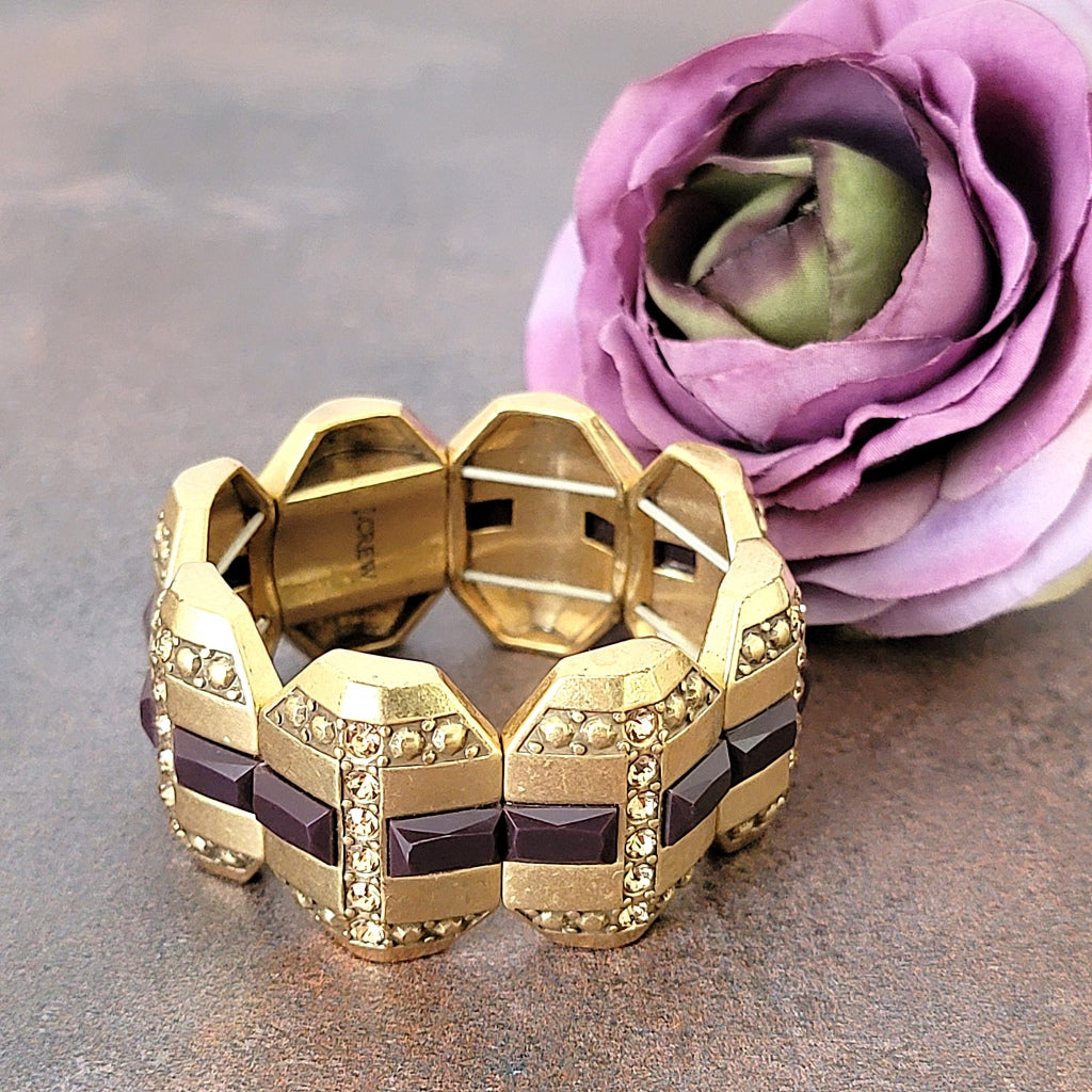 Purple and gold tone rhinestone stretch bracelet.