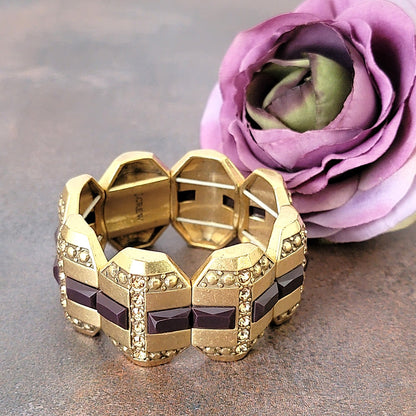 Purple and gold tone rhinestone stretch bracelet.