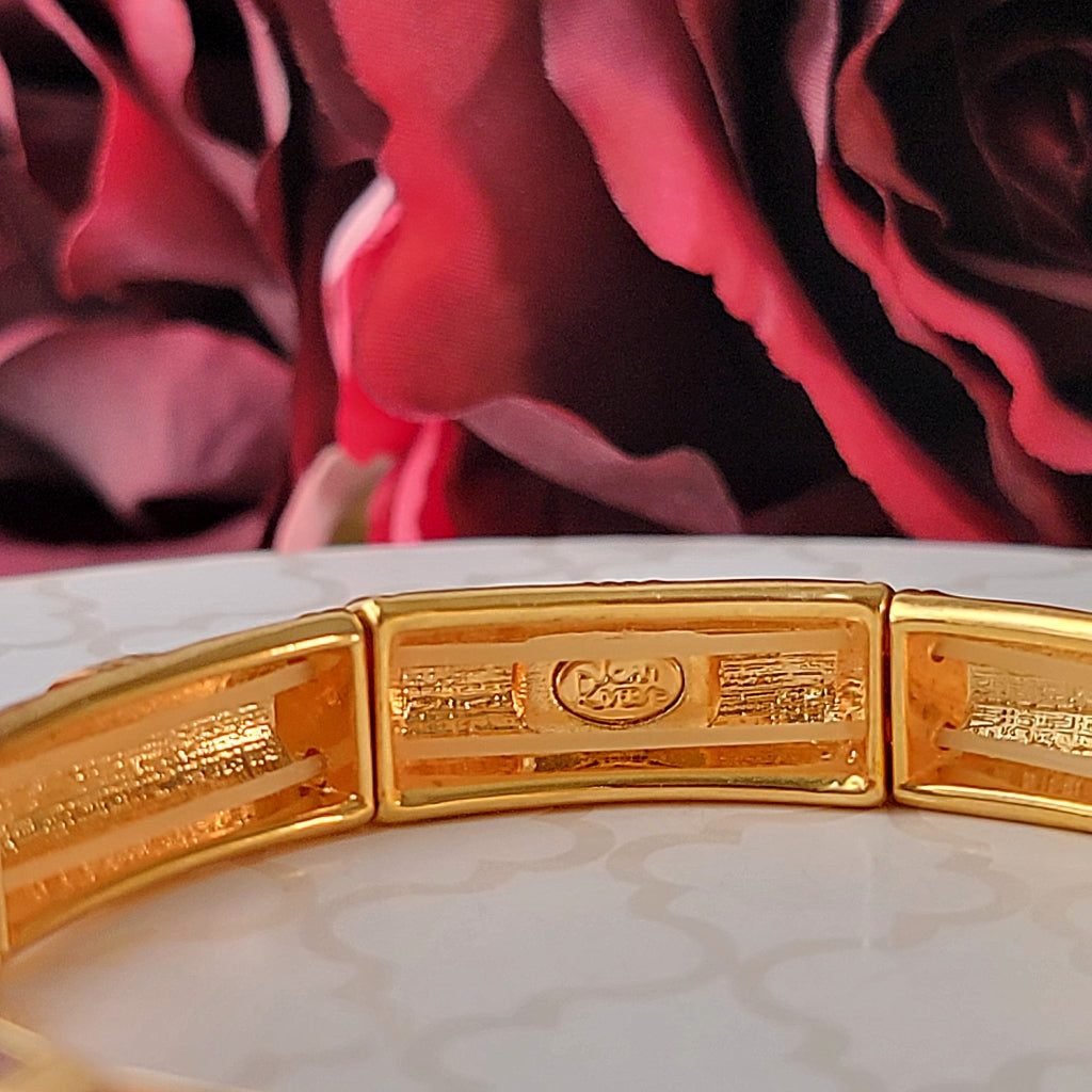 Joan Rivers stamp inside a bracelet.