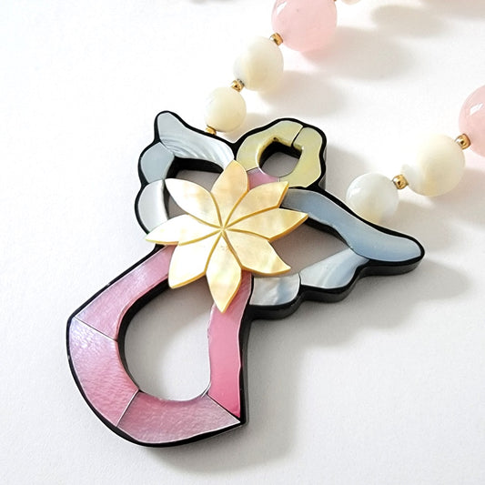 Shell inlay angel pendant.