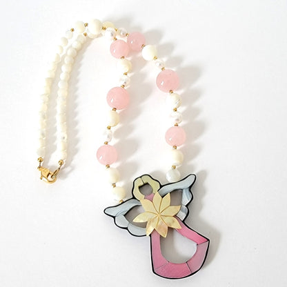 Lee Sands angel necklace.