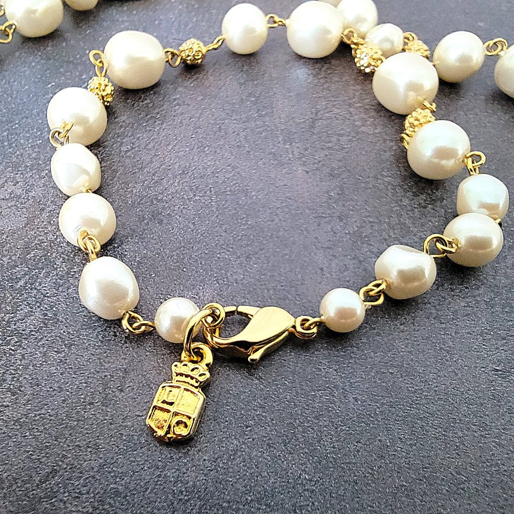Liz Claiborne signature tag on necklace.