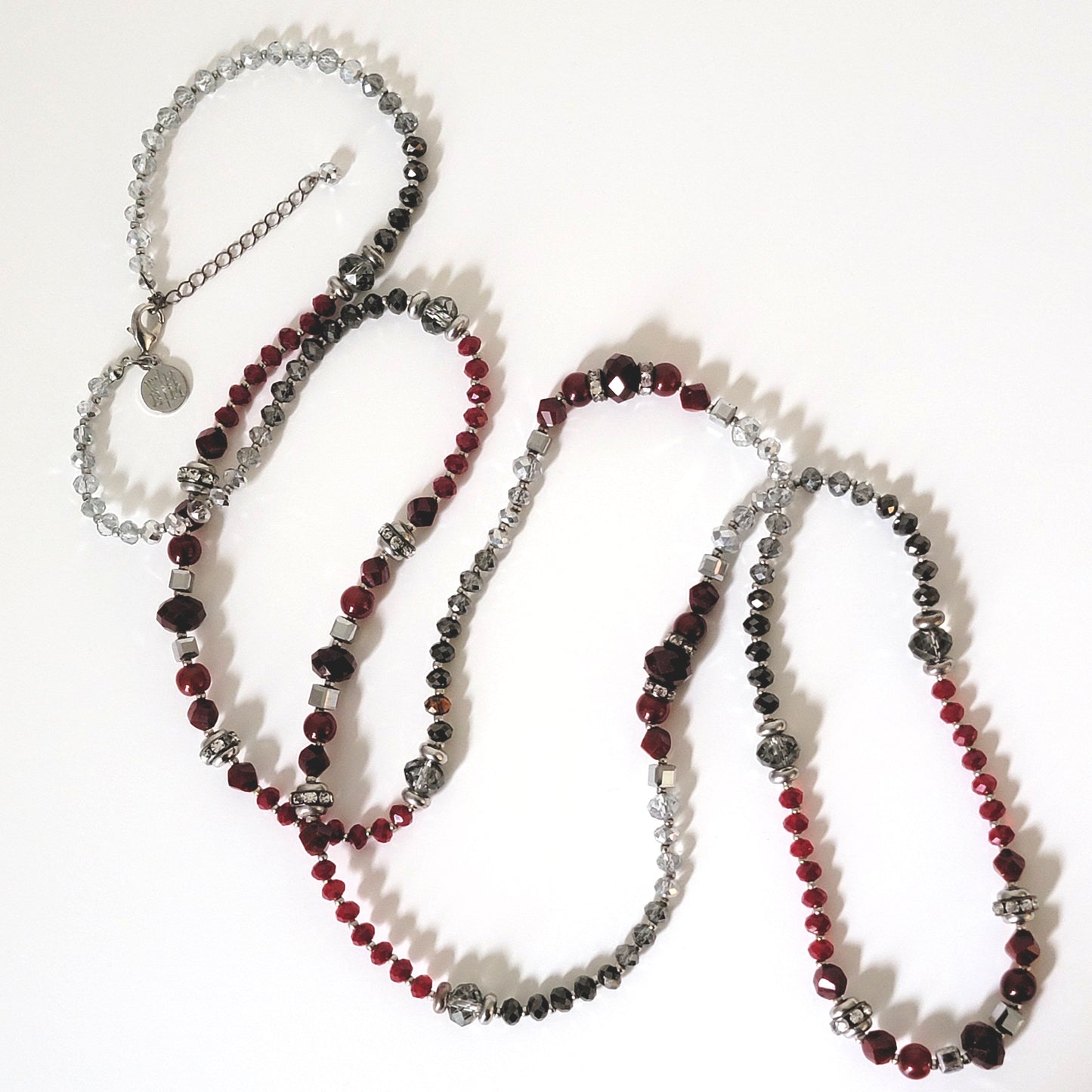 Long red and silver beaded necklace.