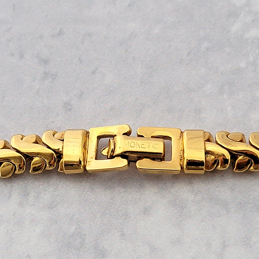 Monet signature on back of a necklace clasp.