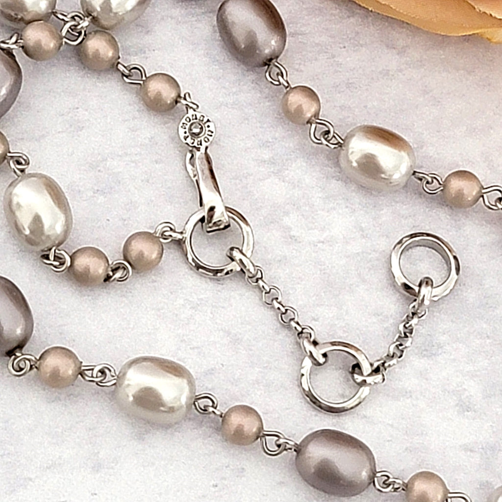 Monet signature on a necklace clasp.