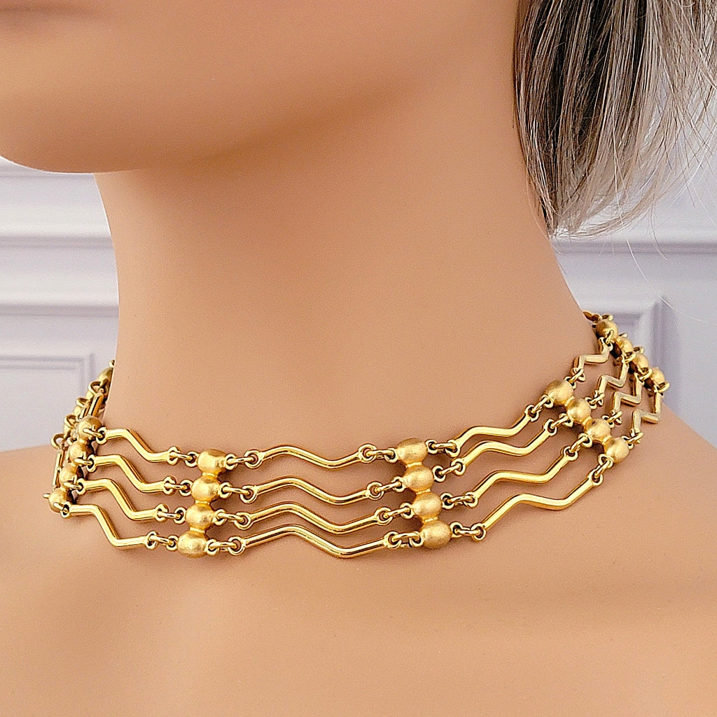 Vintage gold tone Monet choker on a mannequin.