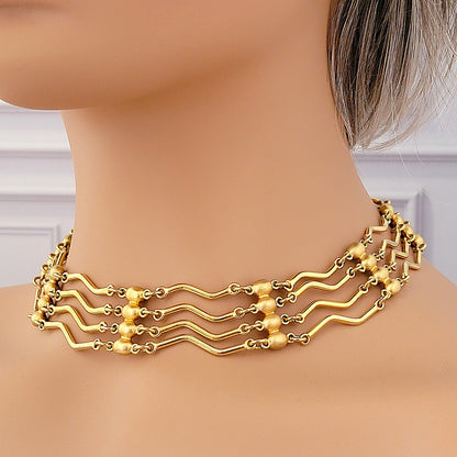 Vintage gold tone Monet choker on a mannequin.