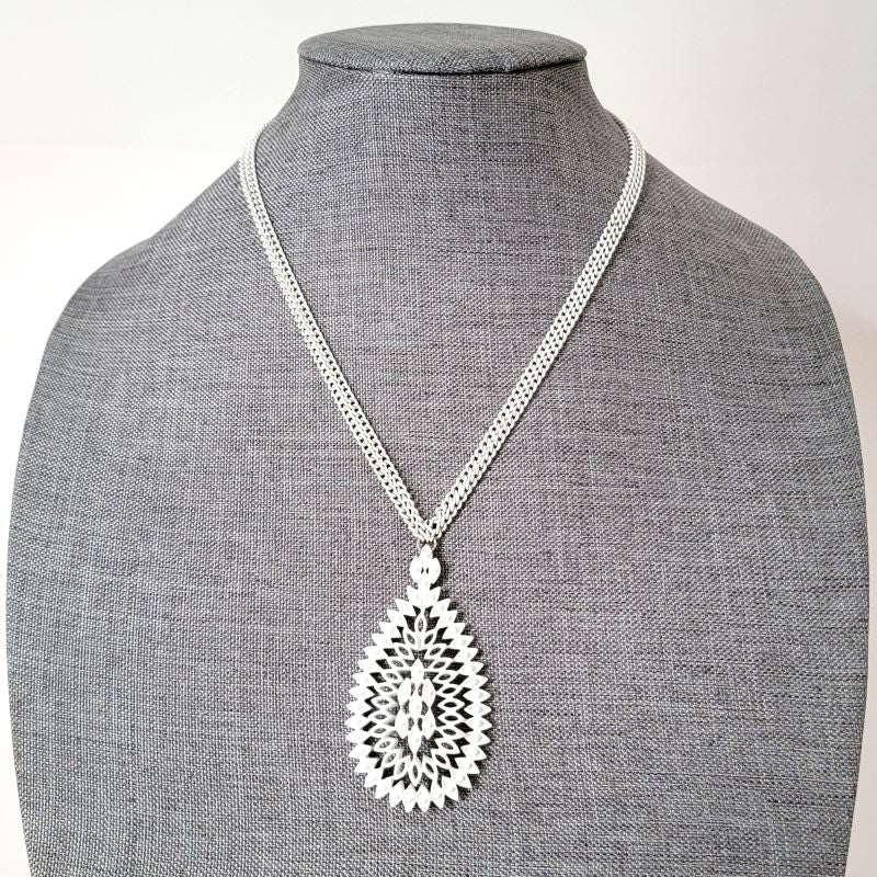 White enamel pendant necklace.