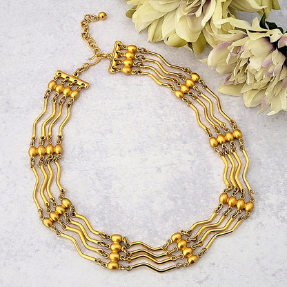 Vintage Monet gold tone midcentury style choker necklace.