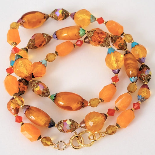 Orange beaded glass and lucite necklace.