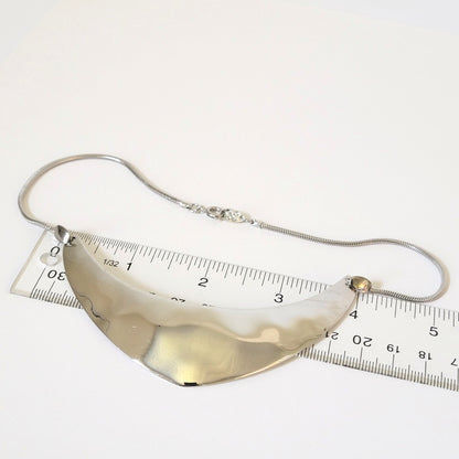 Napier choker next to ruler.