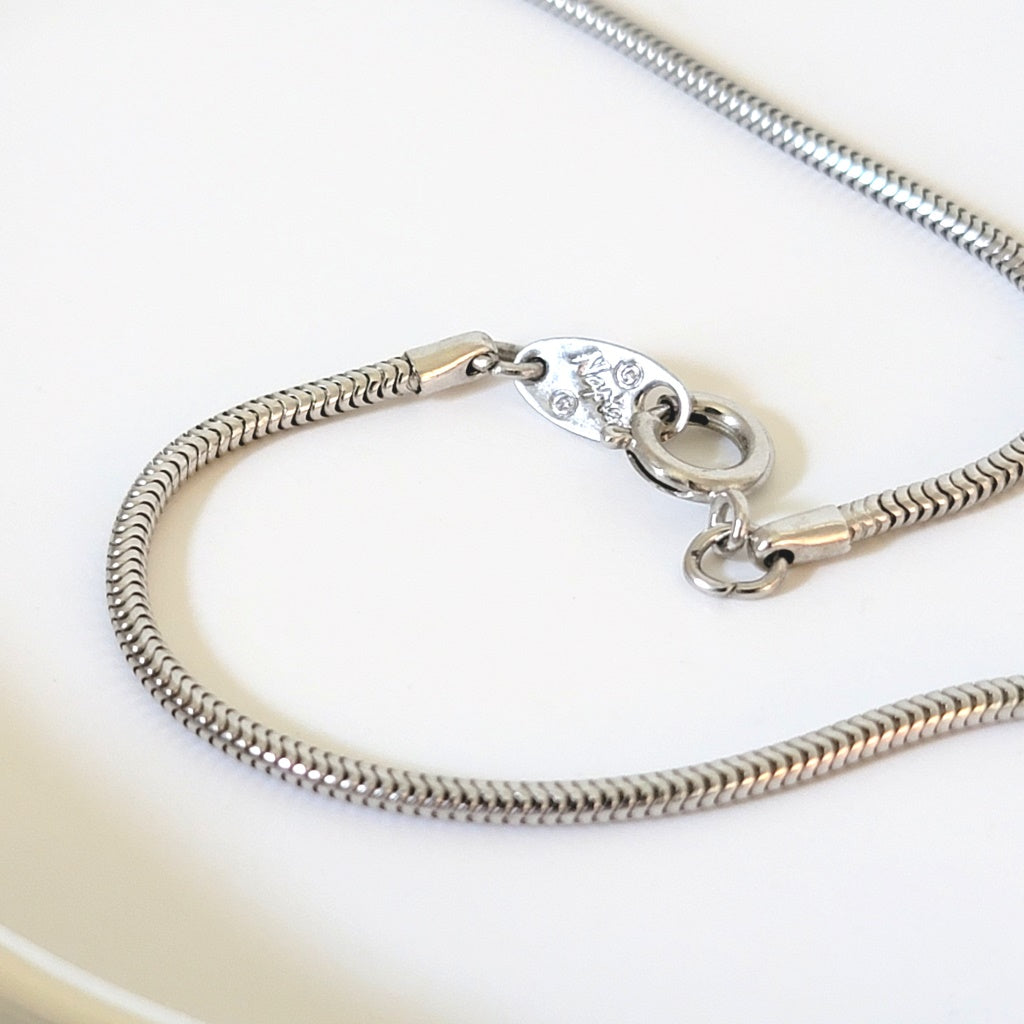 Napier necklace clasp with signature mark.
