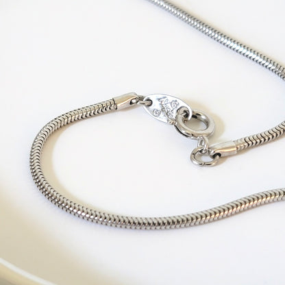 Napier necklace clasp with signature mark.