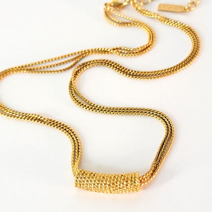 Gold tone slide necklace focal.