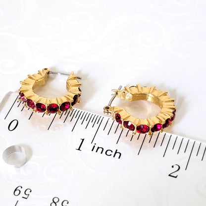 Napier red rhinestone, hoop earrings, shown next to a ruler.