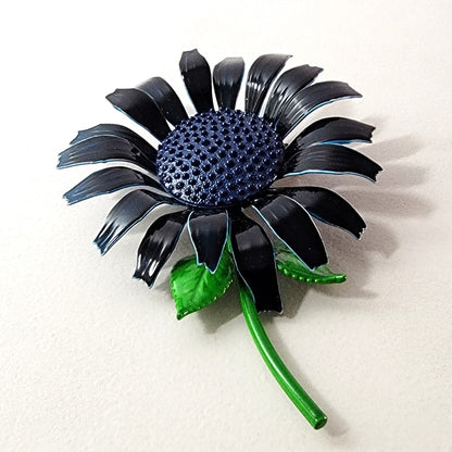 Blue enamel flower brooch with long stem.
