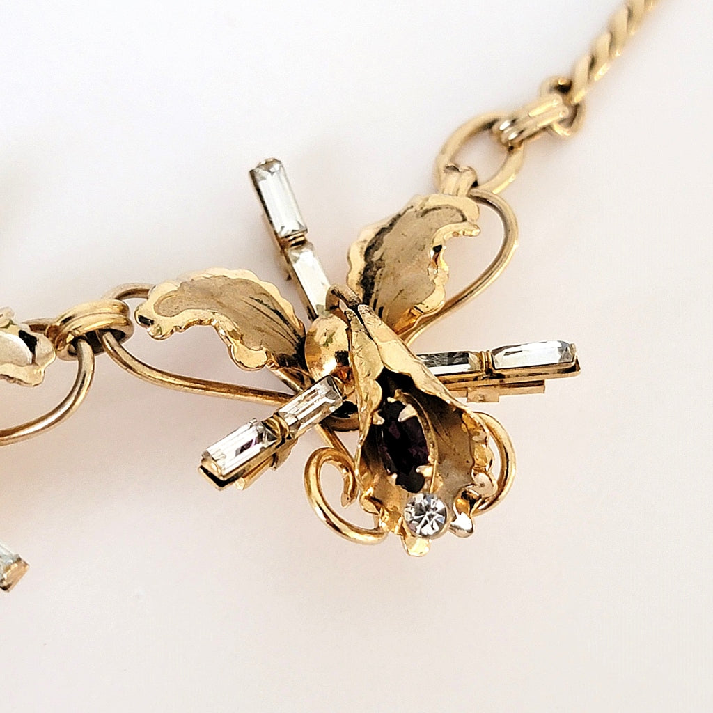 Third rhinestone flower link.