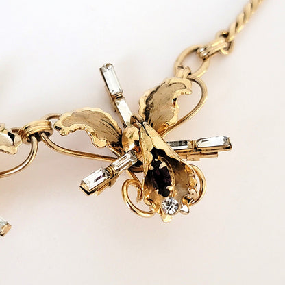 Third rhinestone flower link.