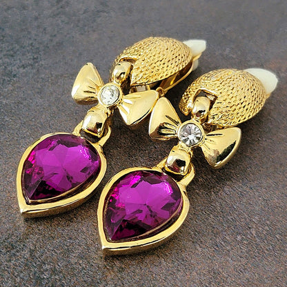 Purple glass tones on vintage dangle earrings.