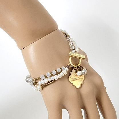 Pearl bracelet on wrist.