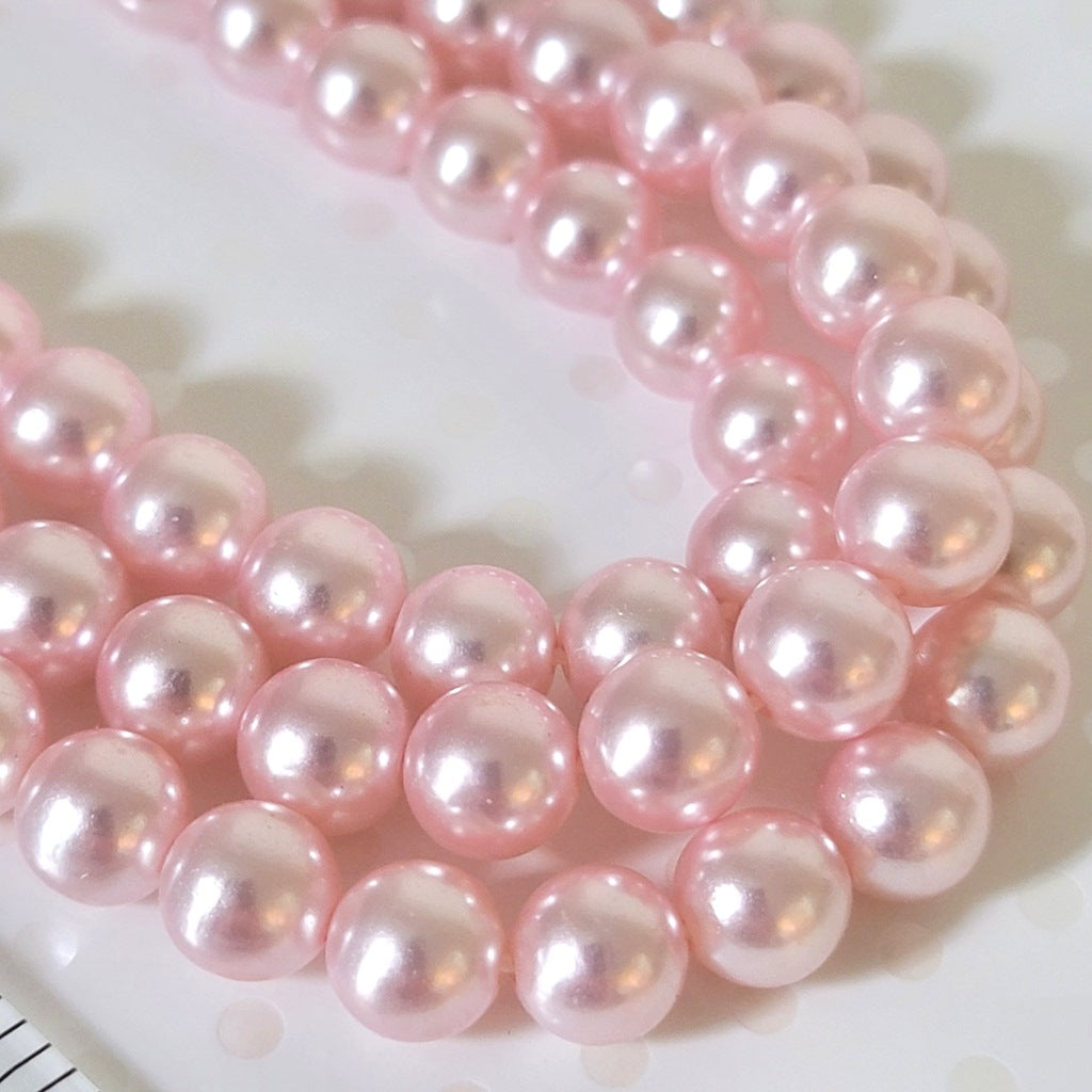 Vintage pastel pink faux pearl beads.