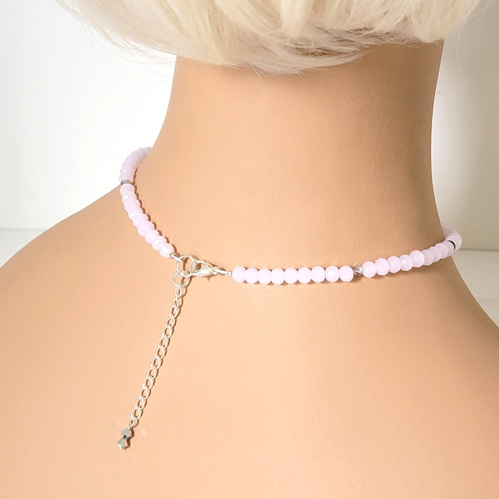 Back view of a pink beaded choker, shown on a mannequin.