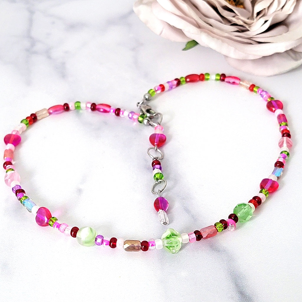 Pink choker necklace with hearts.