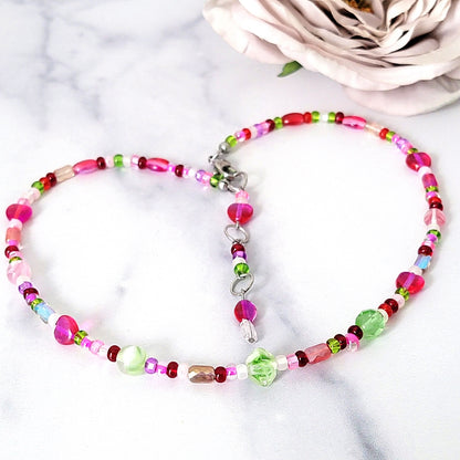 Pink choker necklace with hearts.