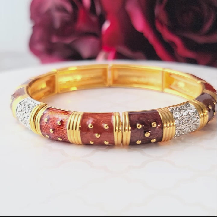 Coppery enamel and rhinestone bracelet, with gold tone metal.