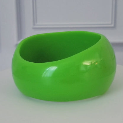 Asymmetrical green acrylic bracelet.