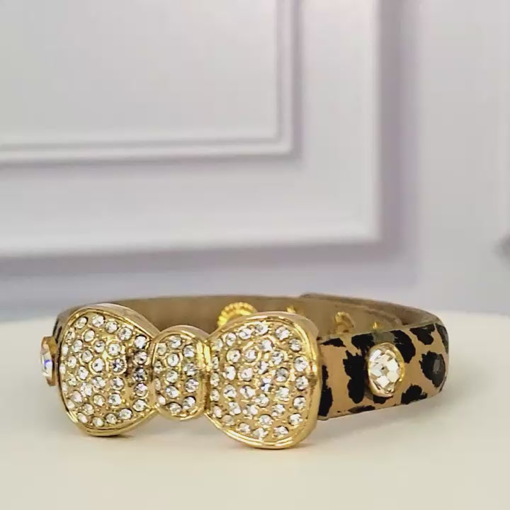 Rhinestone bow bracelet with leopard print band.
