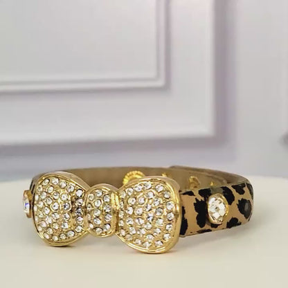 Rhinestone bow bracelet with leopard print band.