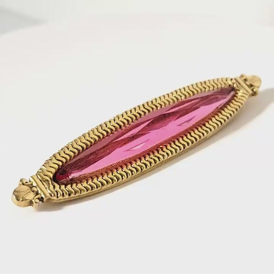 Video of a 1928 pink brooch.